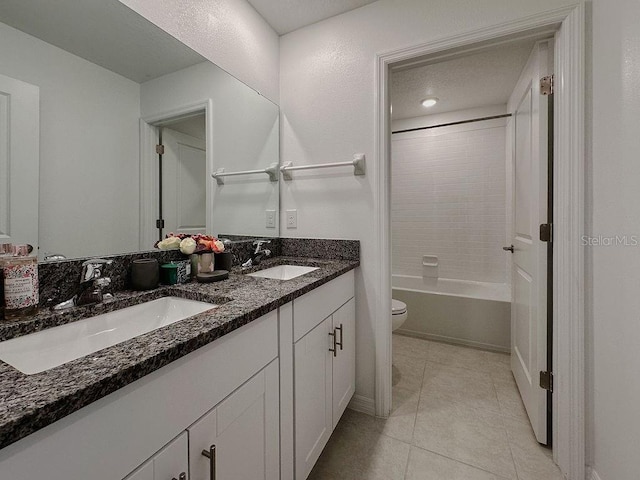 6444 Bar S Bar Trl, Zephyrhills, FL 33541 - bathroom with toilet, tile patterned flooring, double vanity, baseboards, and shower / tub combination