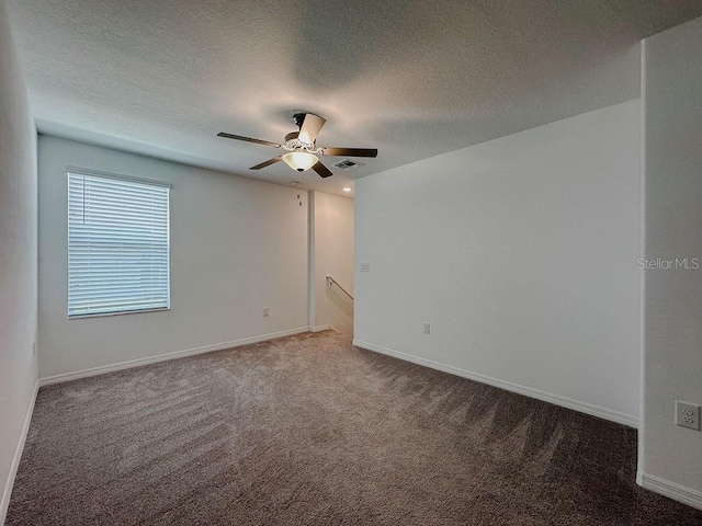 6444 Bar S Bar Trl, Zephyrhills, FL 33541 - unfurnished room with carpet flooring, a ceiling fan, baseboards, and a textured ceiling