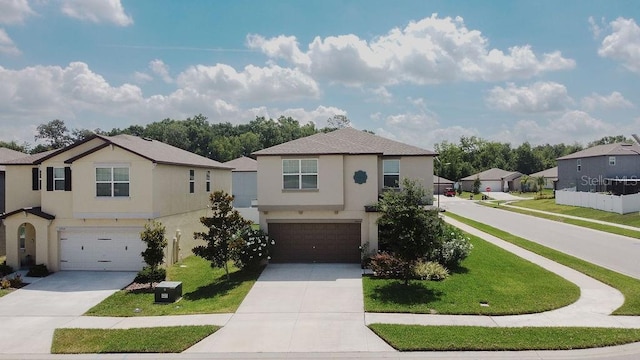 6444 Bar S Bar Trl, Zephyrhills, FL 33541 - view of front facade with a garage, driveway, stucco siding, and a residential view