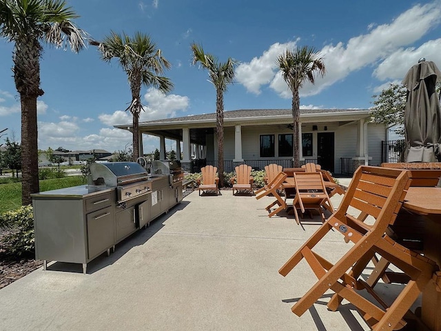 6444 Bar S Bar Trl, Zephyrhills, FL 33541 - view of patio featuring a ceiling fan and outdoor dining area