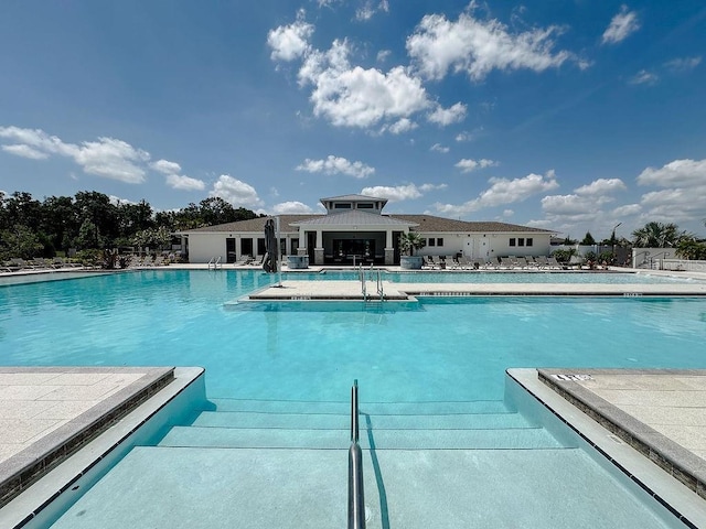 6444 Bar S Bar Trl, Zephyrhills, FL 33541 - community pool with a patio area