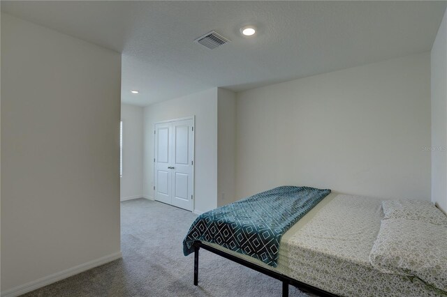 33062 Frosted Clover Way, Wesley Chapel, FL 33545 - bedroom featuring carpet flooring, baseboards, recessed lighting, and a closet