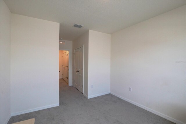 33062 Frosted Clover Way, Wesley Chapel, FL 33545 - unfurnished room with light carpet and baseboards
