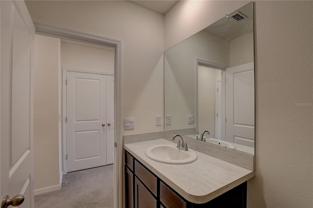 33062 Frosted Clover Way, Wesley Chapel, FL 33545 - bathroom featuring vanity and a textured wall