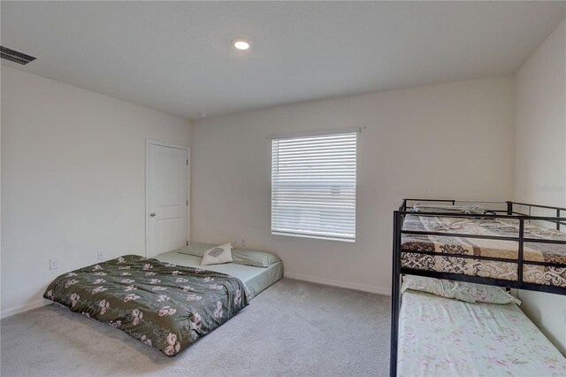 33062 Frosted Clover Way, Wesley Chapel, FL 33545 - carpeted bedroom featuring baseboards