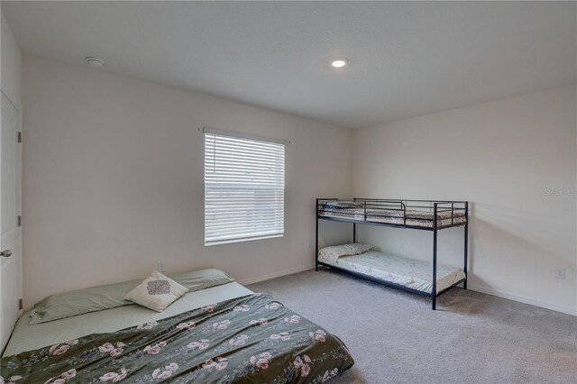 33062 Frosted Clover Way, Wesley Chapel, FL 33545 - carpeted bedroom featuring baseboards and recessed lighting