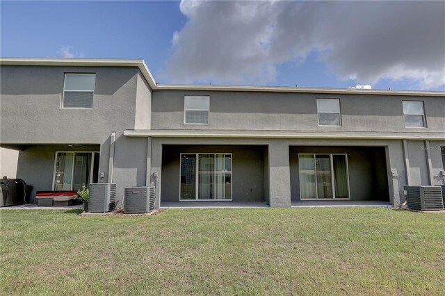 33062 Frosted Clover Way, Wesley Chapel, FL 33545 - back of property with central AC unit and stucco siding