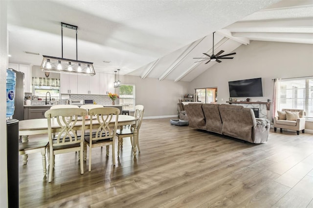 509 Stone Dr, Brandon, FL 33510 - dining space with a ceiling fan, light wood-style flooring, and baseboards