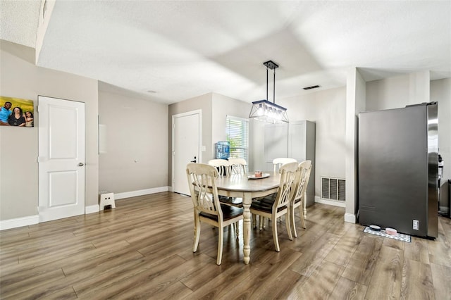 509 Stone Dr, Brandon, FL 33510 - dining area featuring wood finished floors and baseboards