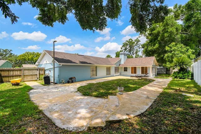 509 Stone Dr, Brandon, FL 33510 - view of front of property featuring a patio and a chimney