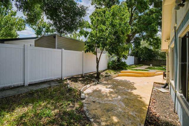 509 Stone Dr, Brandon, FL 33510 - fenced backyard with a patio area