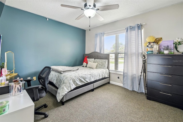 509 Stone Dr, Brandon, FL 33510 - carpeted bedroom with a textured ceiling, an office area, a ceiling fan, and baseboards