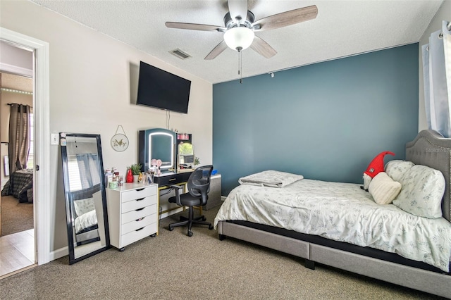 509 Stone Dr, Brandon, FL 33510 - bedroom with carpet, multiple windows, an office area, a textured ceiling, and a ceiling fan