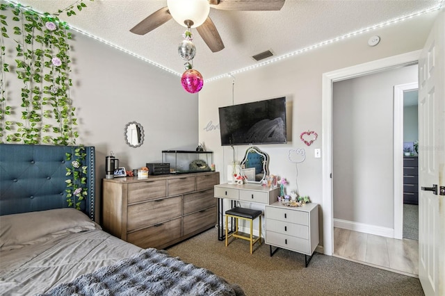 509 Stone Dr, Brandon, FL 33510 - carpeted bedroom featuring a textured ceiling, lofted ceiling, ceiling fan, and baseboards