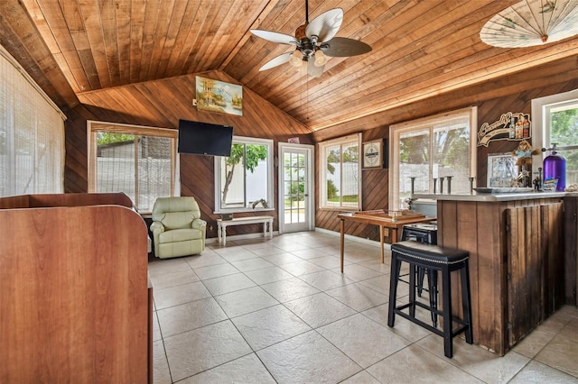 509 Stone Dr, Brandon, FL 33510 - living area with wooden walls, lofted ceiling, wooden ceiling, and a ceiling fan