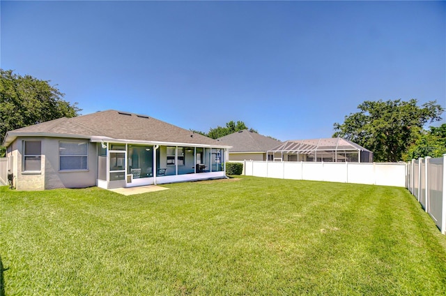 445 Arch Ridge Loop, Seffner, FL 33584 - back of property featuring a sunroom