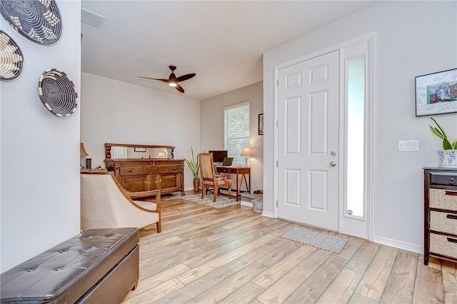 445 Arch Ridge Loop, Seffner, FL 33584 - foyer entrance featuring a ceiling fan, light wood-style flooring, and baseboards