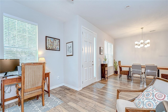 445 Arch Ridge Loop, Seffner, FL 33584 - home office with a chandelier, light wood-style flooring, and baseboards