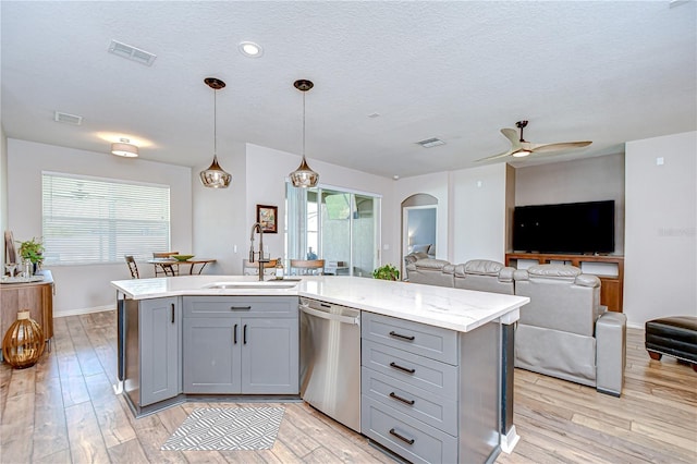 445 Arch Ridge Loop, Seffner, FL 33584 - kitchen featuring gray cabinetry, a sink, dishwasher, open floor plan, and light wood finished floors