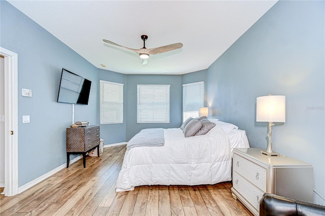 445 Arch Ridge Loop, Seffner, FL 33584 - bedroom featuring light wood-style flooring, baseboards, and a ceiling fan