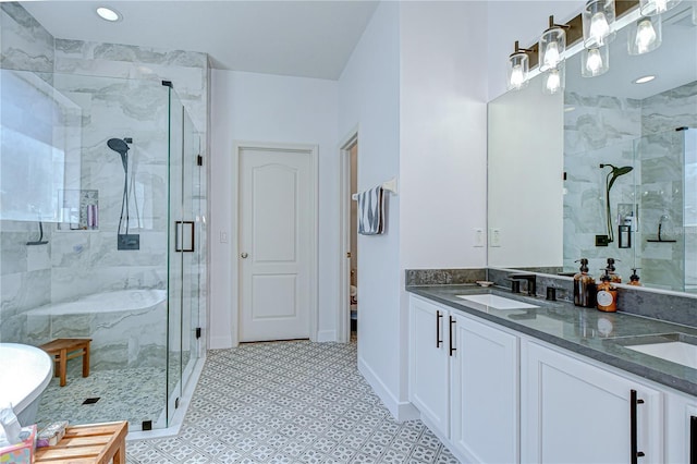 445 Arch Ridge Loop, Seffner, FL 33584 - bathroom featuring a shower stall, double vanity, recessed lighting, and baseboards