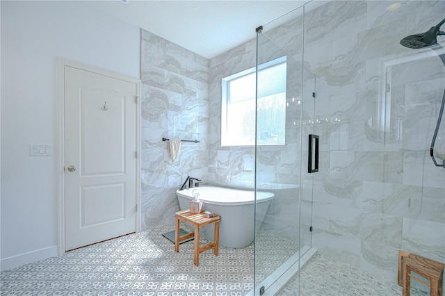 445 Arch Ridge Loop, Seffner, FL 33584 - bathroom featuring a shower stall, a freestanding tub, and baseboards