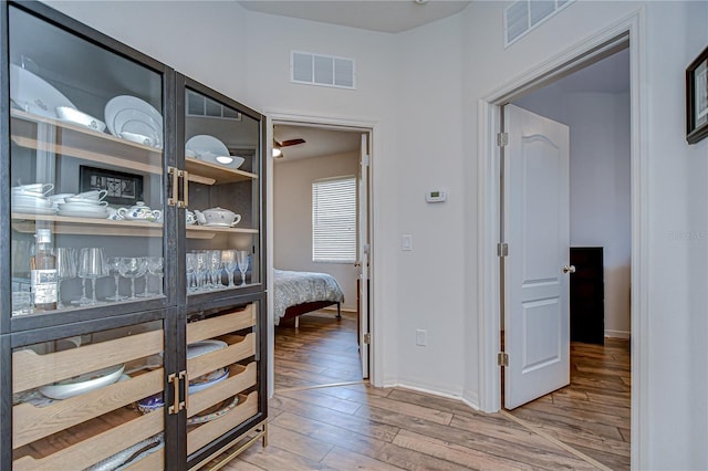 445 Arch Ridge Loop, Seffner, FL 33584 - corridor featuring wood finished floors and baseboards