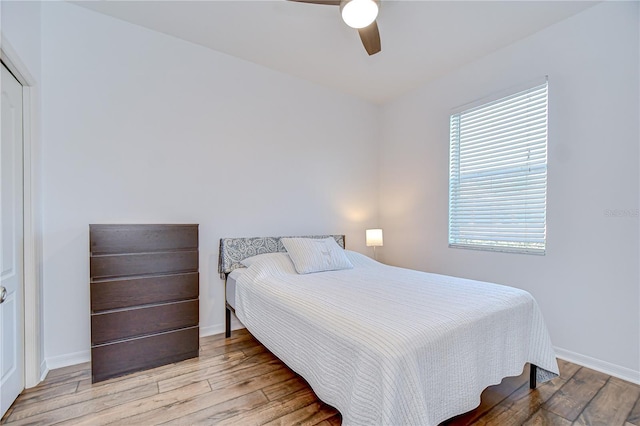 445 Arch Ridge Loop, Seffner, FL 33584 - bedroom with wood finished floors, baseboards, and ceiling fan