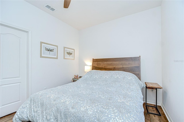 445 Arch Ridge Loop, Seffner, FL 33584 - bedroom with wood finished floors, a ceiling fan, and baseboards