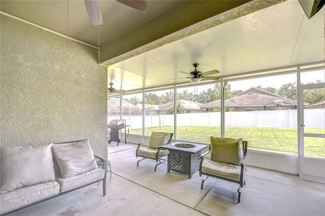 445 Arch Ridge Loop, Seffner, FL 33584 - sunroom with a ceiling fan, a fire pit, and healthy amount of natural light
