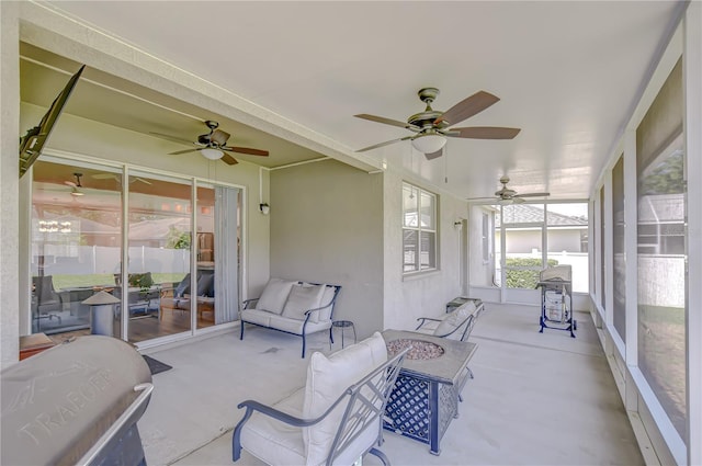 445 Arch Ridge Loop, Seffner, FL 33584 - sunroom featuring ceiling fan and a fire pit