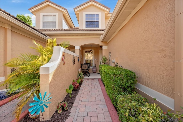 7246 Gaberia Rd, New Port Richey, FL 34655 - entrance to property featuring stucco siding and a tile roof
