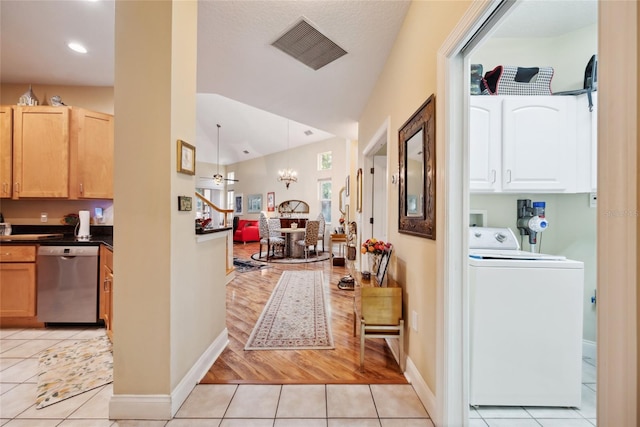 7246 Gaberia Rd, New Port Richey, FL 34655 - hall with washer / dryer, light tile patterned floors, vaulted ceiling, baseboards, and recessed lighting