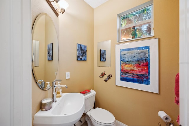 7246 Gaberia Rd, New Port Richey, FL 34655 - half bathroom with toilet and a sink