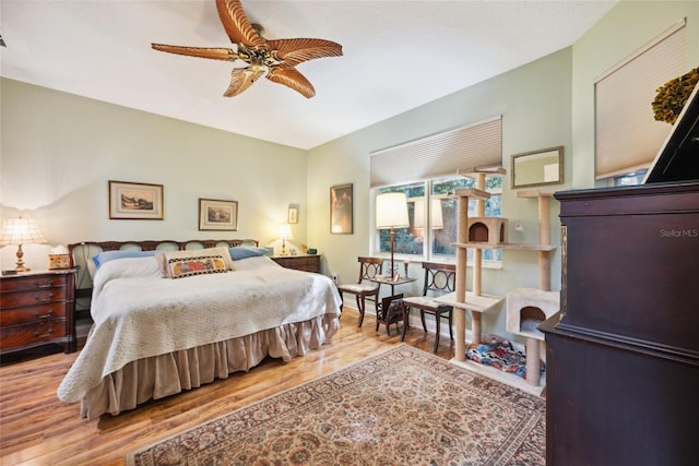 7246 Gaberia Rd, New Port Richey, FL 34655 - bedroom with wood finished floors and a ceiling fan