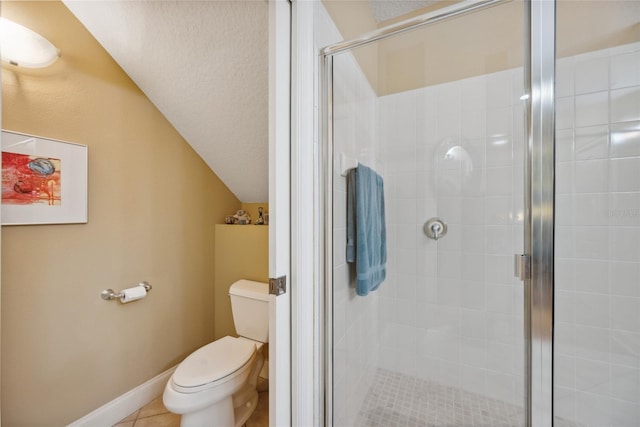 7246 Gaberia Rd, New Port Richey, FL 34655 - full bathroom featuring toilet, lofted ceiling, a stall shower, and tile patterned floors
