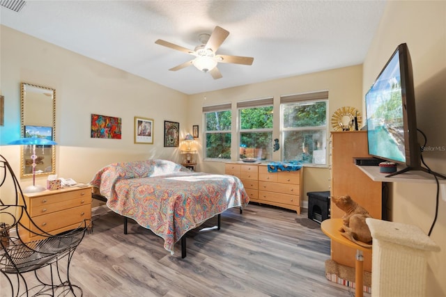 7246 Gaberia Rd, New Port Richey, FL 34655 - bedroom featuring wood finished floors and a ceiling fan