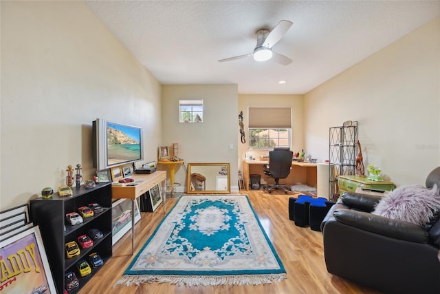 7246 Gaberia Rd, New Port Richey, FL 34655 - living area with a desk, wood finished floors, and ceiling fan