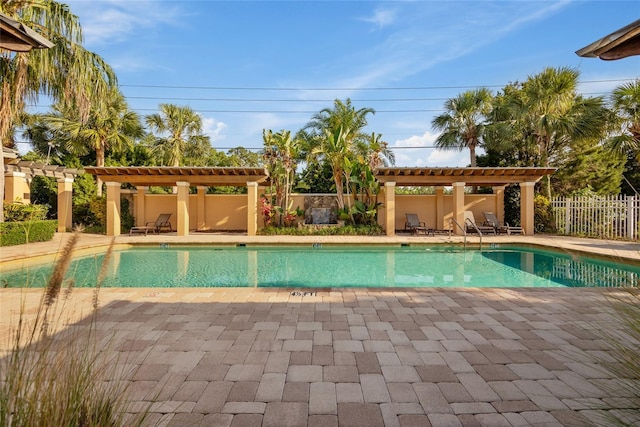 7246 Gaberia Rd, New Port Richey, FL 34655 - community pool featuring a pergola and a patio area