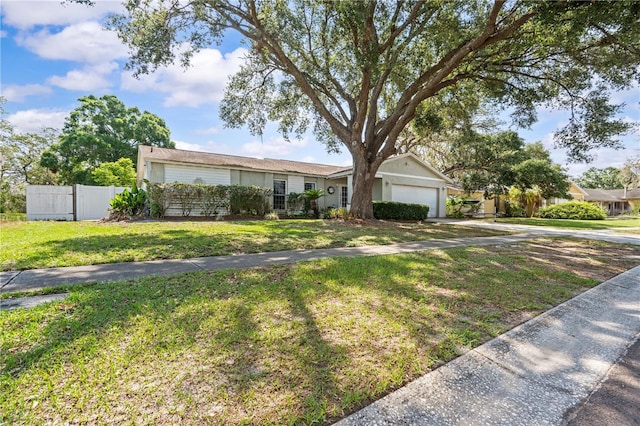 ranch-style home featuring an attached garage and concrete driveway