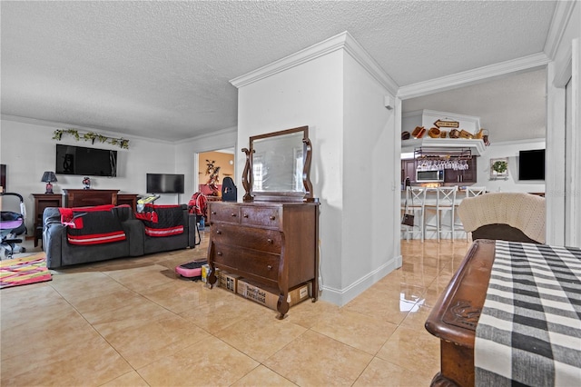 tiled living room featuring ornamental molding and a textured ceiling