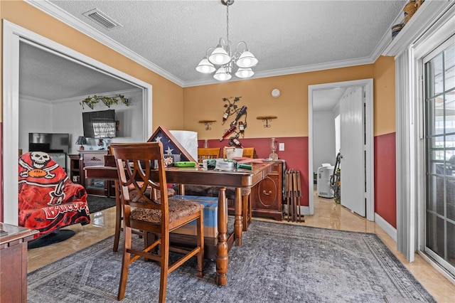 dining room with a textured ceiling, a chandelier, crown molding, and tile patterned flooring