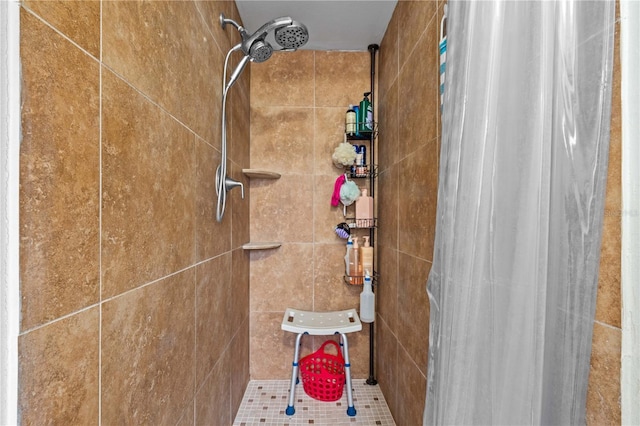 bathroom with a tile shower