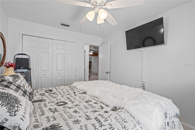 bedroom with a closet and a ceiling fan