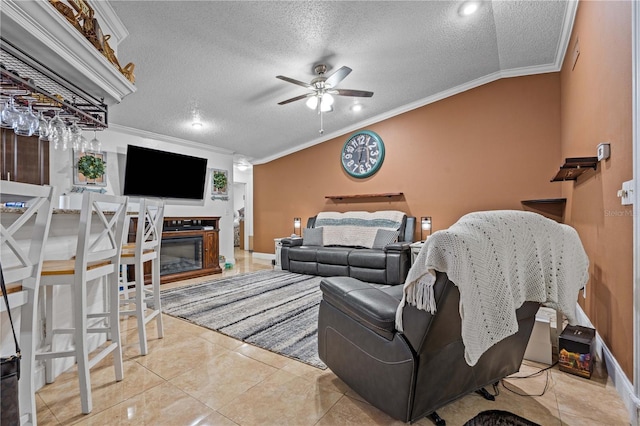 living room featuring crown molding, a ceiling fan, a textured ceiling, lofted ceiling, and a glass covered fireplace