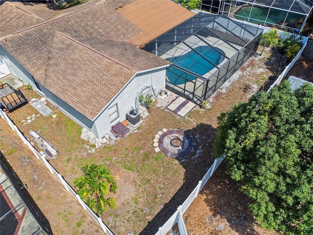 aerial view of property and surrounding area featuring a pool