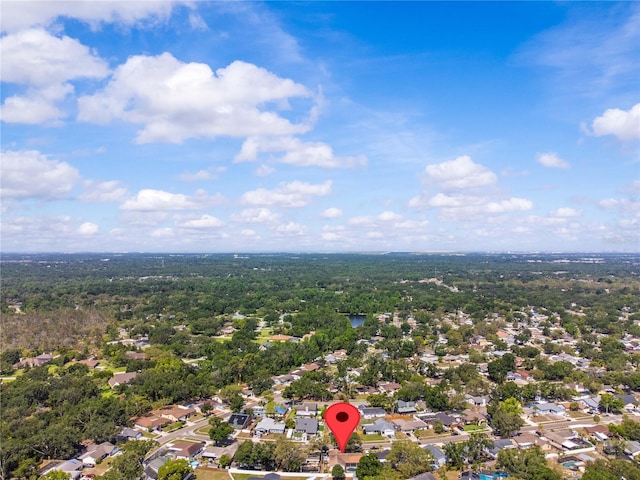 aerial view of residential area with a heavily wooded area