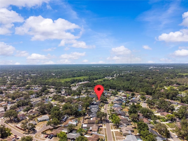 aerial view of residential area featuring a heavily wooded area