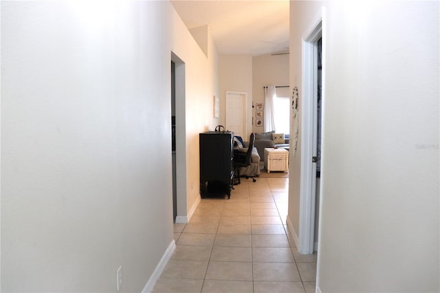 1048 Winding Water Way, Clermont, FL 34714 - hallway with light tile patterned floors and baseboards
