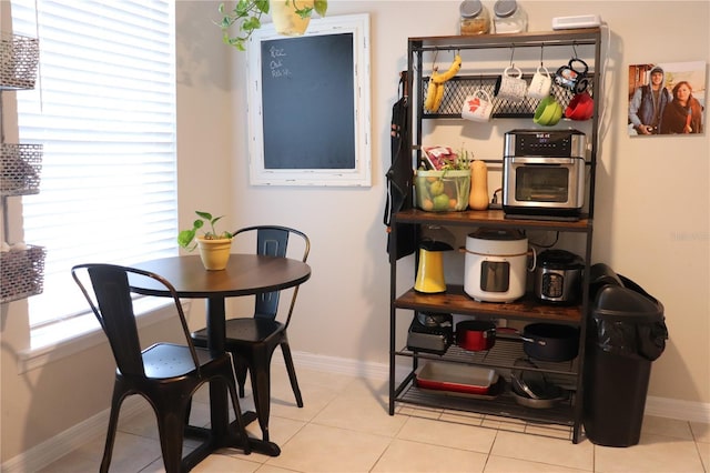 1048 Winding Water Way, Clermont, FL 34714 - tiled dining space with baseboards